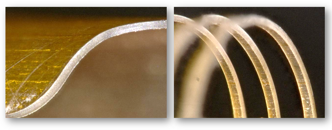 Polymer (polyimide) tube with high-quality cut features demonstrating capabilities of IR femtosecond lasers for processing medical-grade polymers